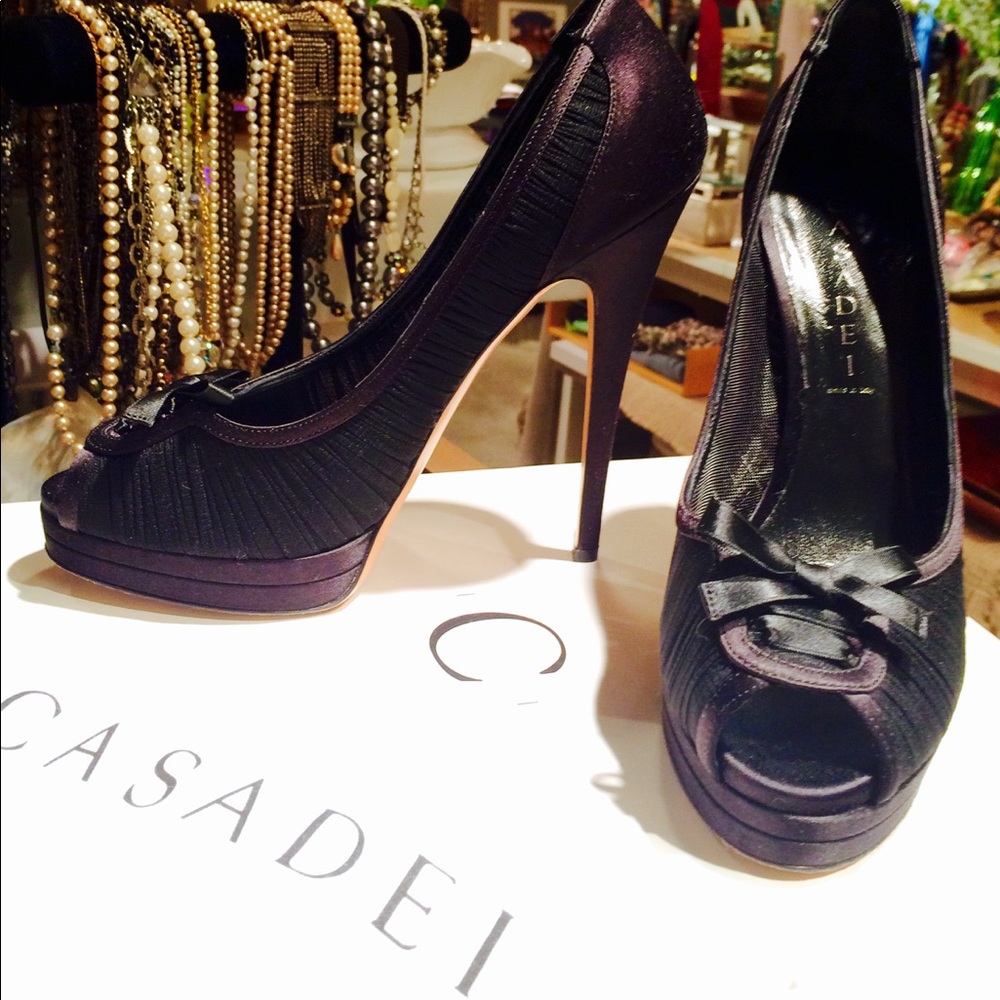 Casadei Black Peeptoe platform pumps.